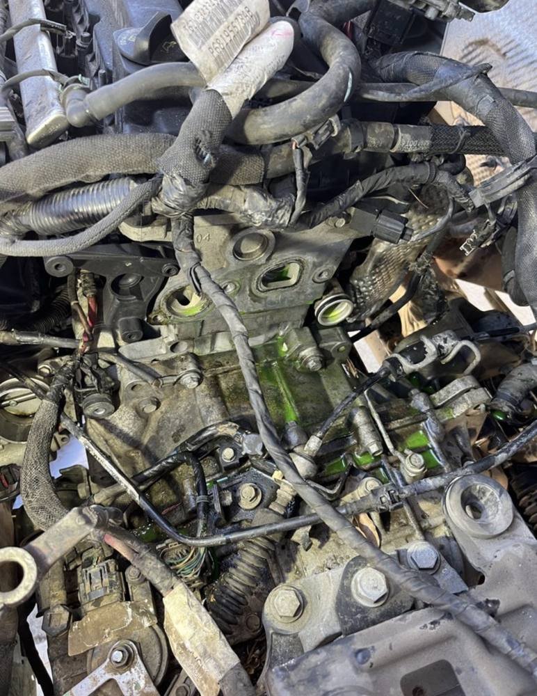 Water pump area opened up for a cooling repair